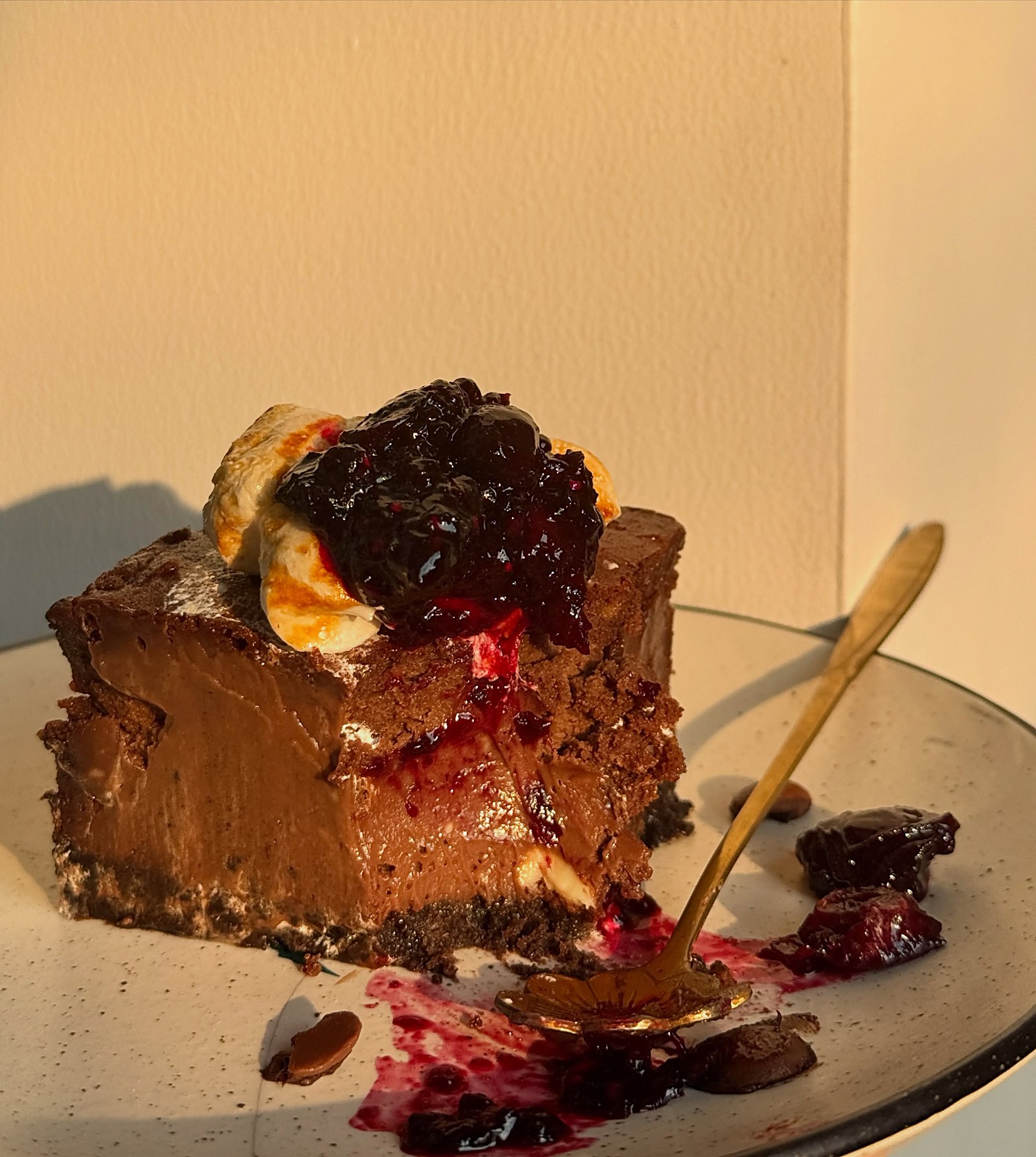 Belgian chocolate cheesecake slice with berry compote
